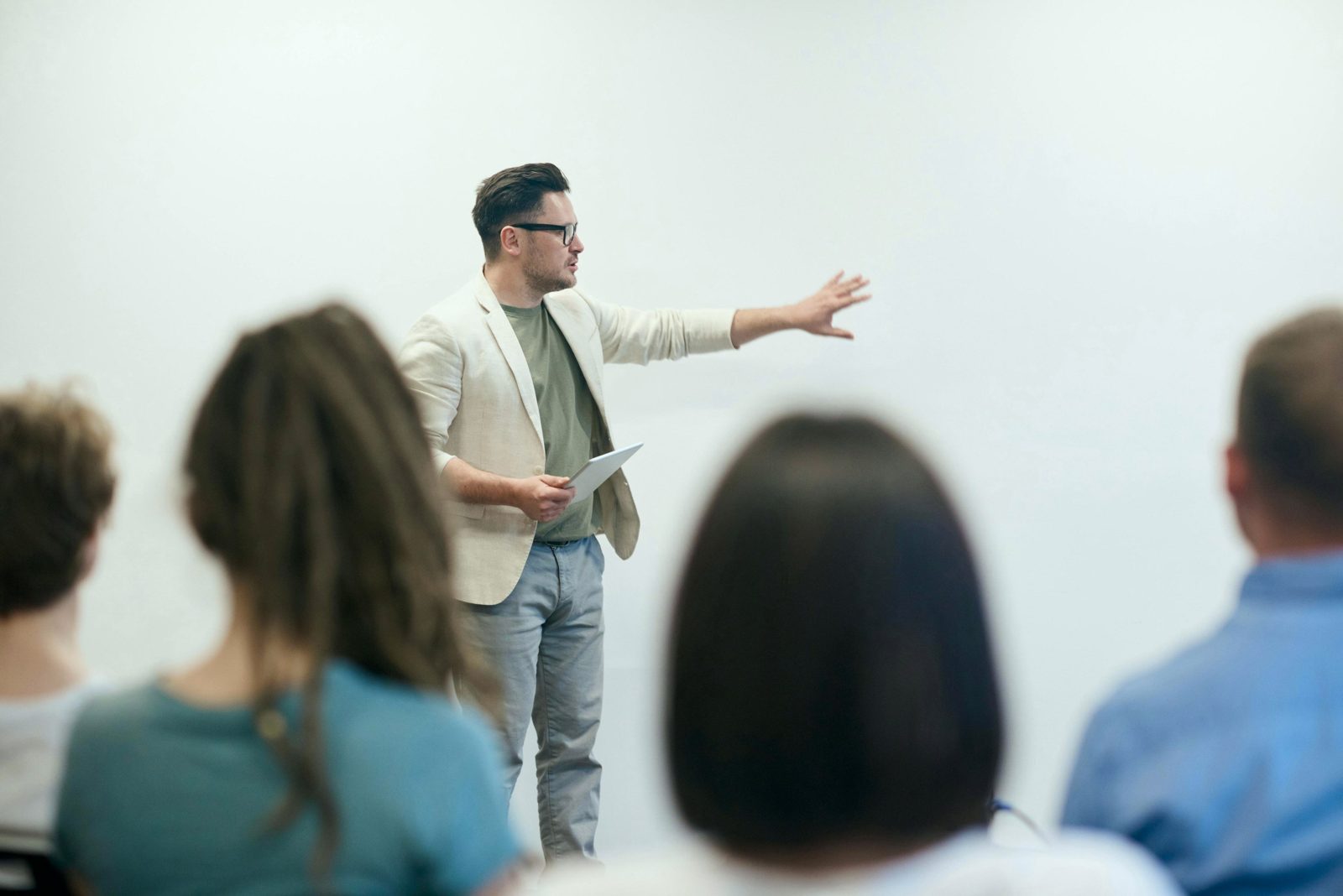 A facilitator talking to a team in a meeting